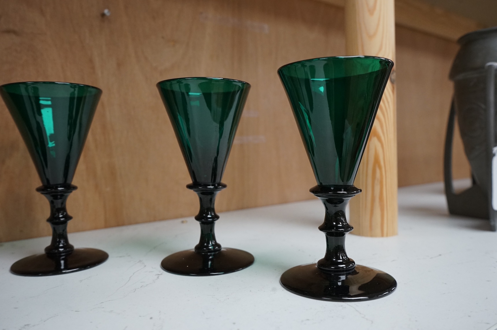 A late Georgian set of six green glasses, 13cm high